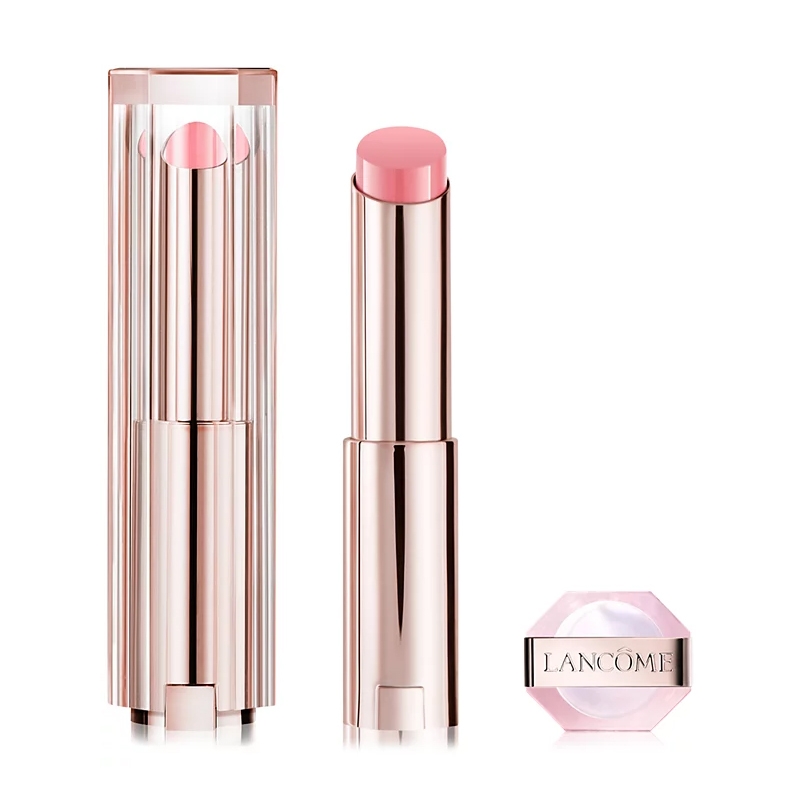 A Lancôme lipstick with a metallic pink tube and a matching cap on the side, showcasing a light pink shade.