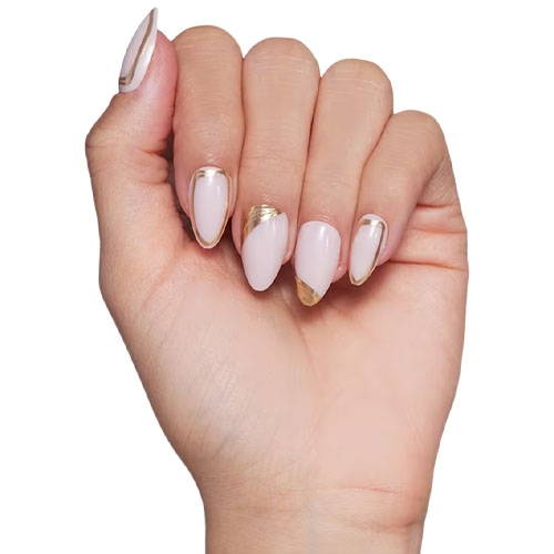 a hand with a light pink and gold manicure