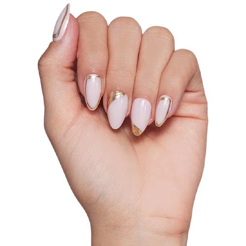 a hand with a light pink and gold manicure