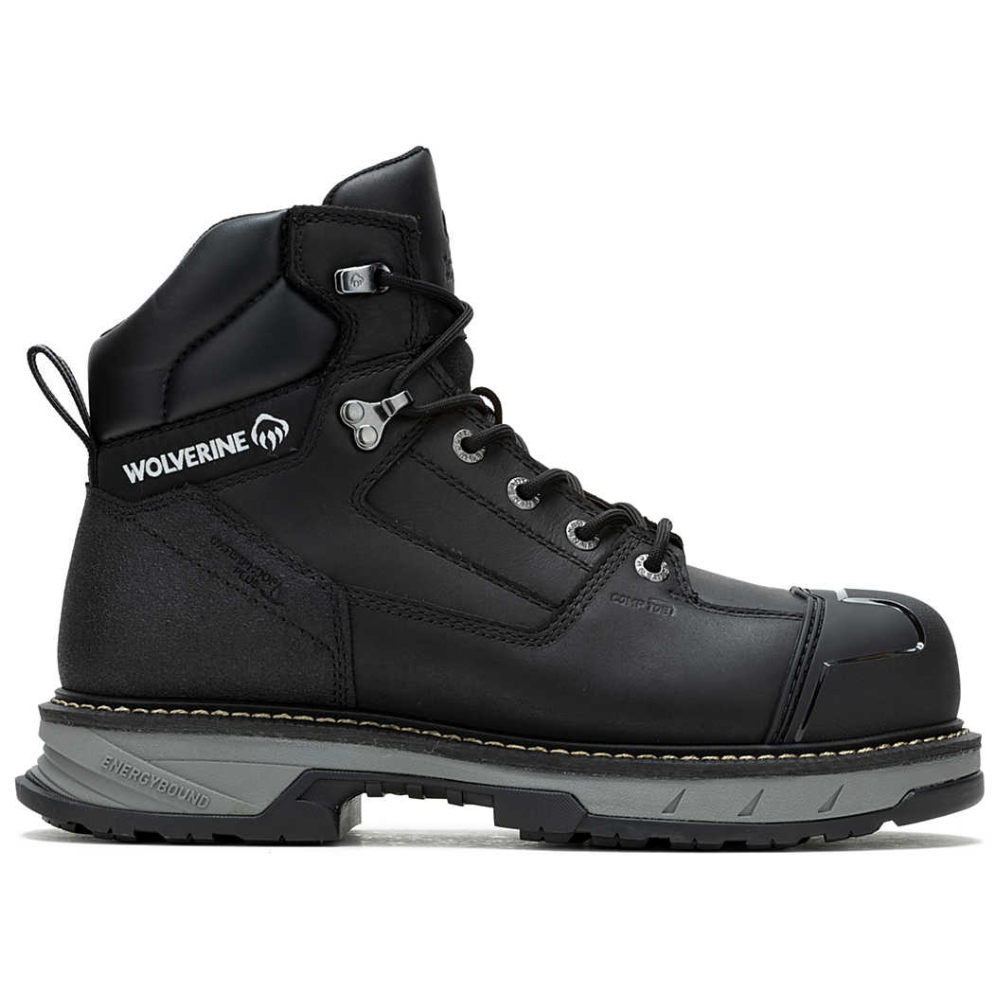 A black Wolverine branded work boot with a composite toe, rugged sole, and lace-up design. The boot features the \“Energybound\“ sole technology indicated on the heel.