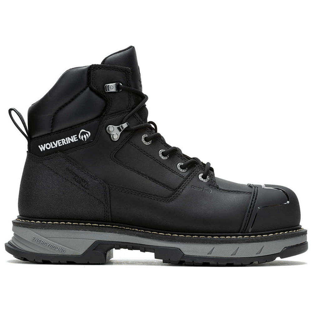 A black Wolverine branded work boot with a composite toe, rugged sole, and lace-up design. The boot features the \“Energybound\“ sole technology indicated on the heel.