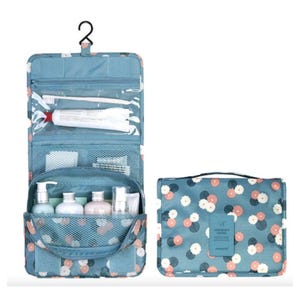 A hanging toiletry bag with floral pattern, open to show compartments with toiletries, alongside its folded version.