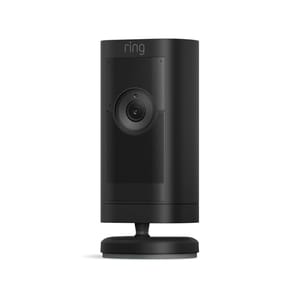 The Ring Stick Up Cam Pro is a black, cylindrical security camera designed for indoor use, featuring a single lens and built-in speaker for two-way audio. It is mounted on a circular base and supports Wi-Fi connectivity.