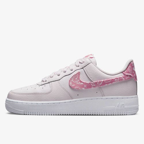 White Nike Air Force 1 sneaker with pink paisley patterns.