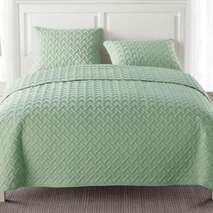 3-piece queen quilt set in a soft green color with a textured, geometric pattern, includes a quilt and two matching pillow shams.