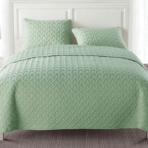 3-piece queen quilt set in a soft green color with a textured, geometric pattern, includes a quilt and two matching pillow shams.