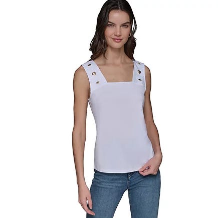 Sleeveless white square-neck top with grommet details on the straps, paired with blue jeans.