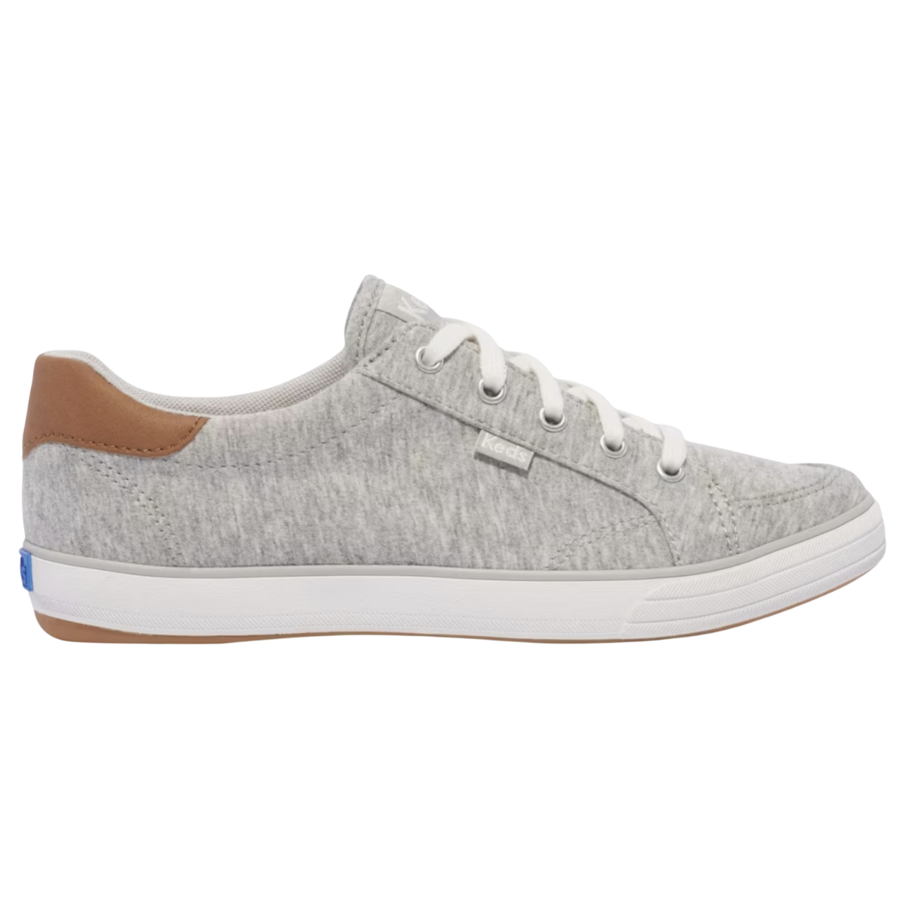 A gray Keds sneaker with white laces and a brown heel accent on a white rubber sole.