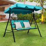 Outdoor three-seater swing with canopy and cushions.