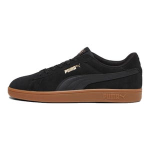 A black Puma sneaker with a brown sole and the brand's logo on the side.