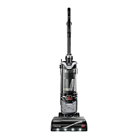 A black upright vacuum cleaner with a clear dust canister and handle, featuring the Bissell brand logo and designed for efficient floor cleaning.