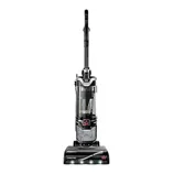 A black upright vacuum cleaner with a clear dust canister and handle, featuring the Bissell brand logo and designed for efficient floor cleaning.