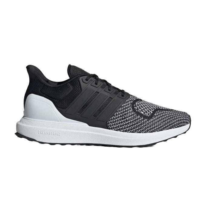 A black and white running shoe with a knit upper, featuring three stripe detailing on the side and a white Dreamstrike sole.