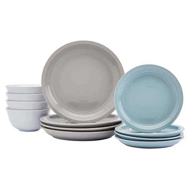 A dinnerware set featuring four white bowls, three gray plates, and three light blue plates. The set includes both larger dinner plates and smaller salad plates.