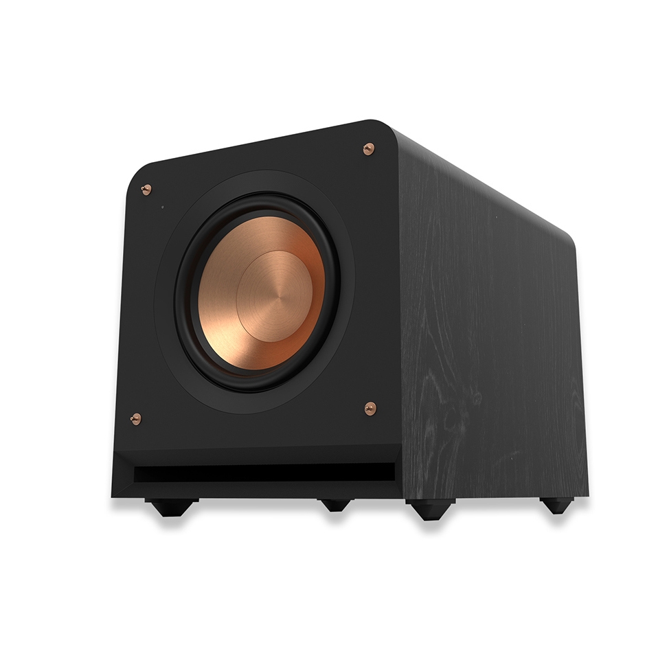 The Klipsch Subwoofer features a black rectangular cabinet with a copper-colored woofer and visible wood grain texture. It has a front-firing design with four stabilizing feet and copper fasteners on the corners.