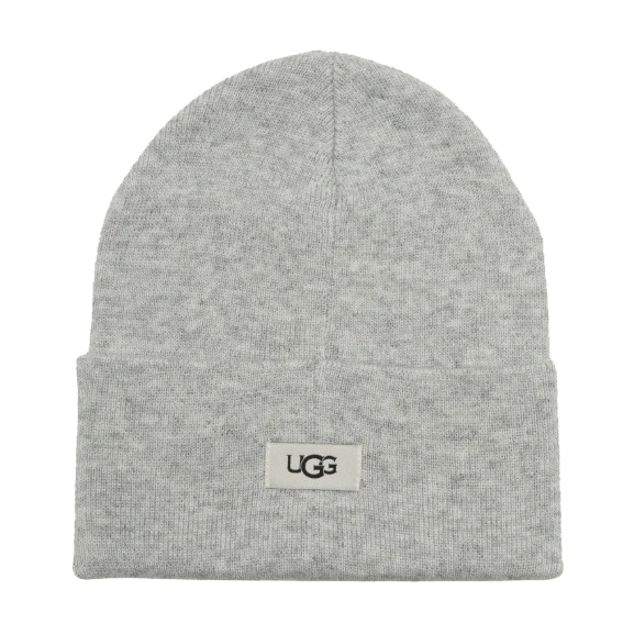 A gray beanie with a folded cuff featuring the UGG logo on a small rectangular patch.