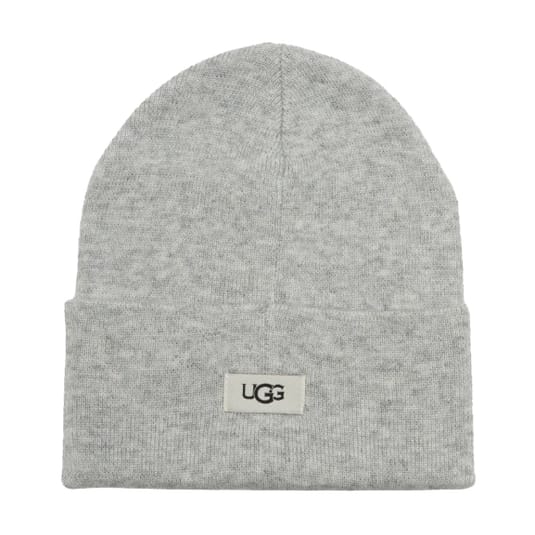 A gray beanie with a folded cuff featuring the UGG logo on a small rectangular patch.