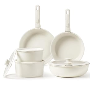 Carote Detachable-Handle Cookware Set includes two fry pans with detachable handles, stacking saucepans with lids, and a sauté pan with a lid, all in a white, non-stick finish.