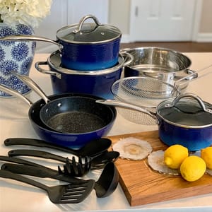Blue cookware set including pots, pans, and utensils, with a stainless steel strainer.