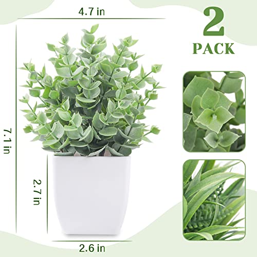 Set of two artificial green plants in white square pots, dimensions provided for height and pot size.