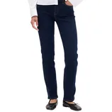 Dark blue straight-leg jeans paired with black ballet flats and a white blouse.