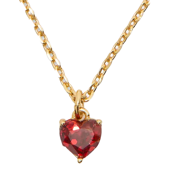 Gold chain necklace featuring a heart-shaped red gemstone pendant.