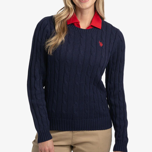 Navy blue cable knit sweater with a red collar peeking out and a small red logo on the chest.