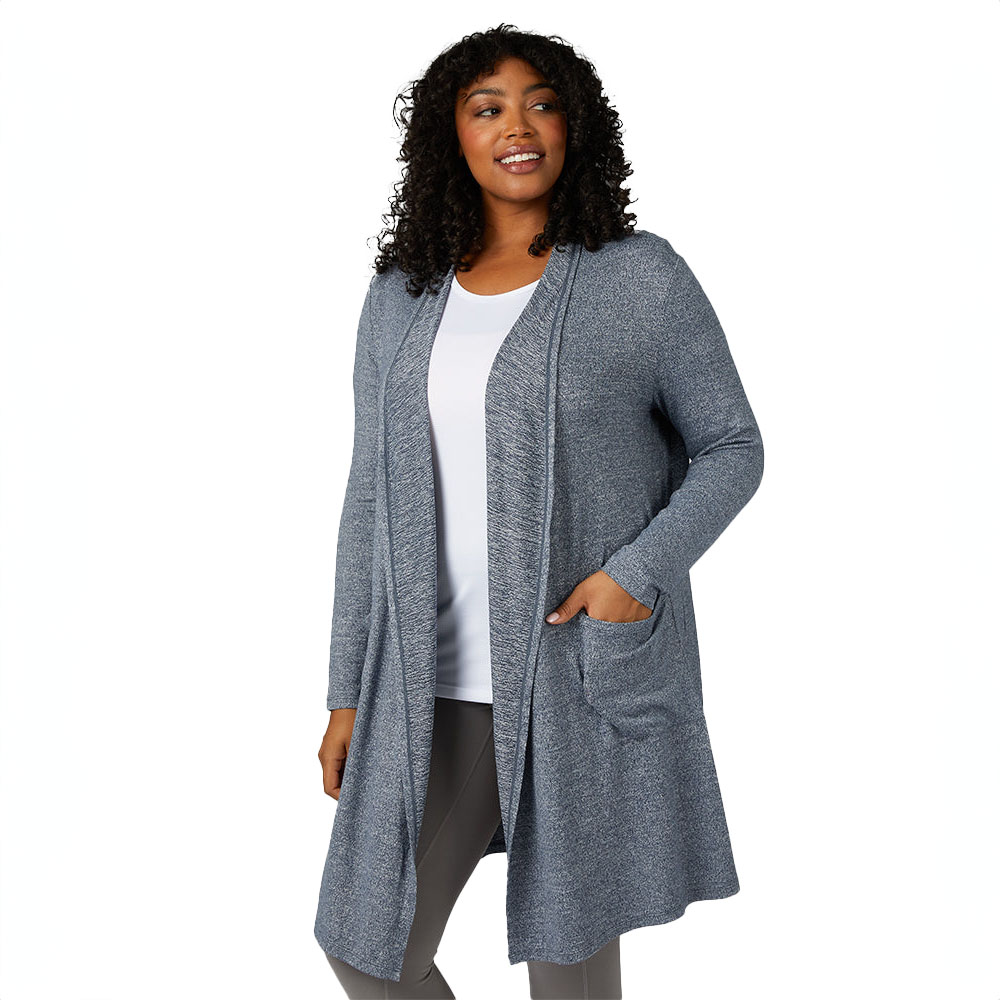 A woman wearing a 32 Degrees Soft Comfy Wrap, which is a long, open-front cardigan with pockets, in a heathered gray color. She pairs it with a white top and gray leggings.
