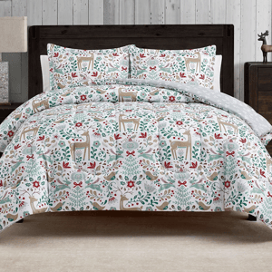 A festive 3-piece comforter set with a holiday theme featuring deers, birds, and floral designs in red, green, and beige on a white background. Includes a comforter and matching pillow shams, all with a rustic woodland pattern.