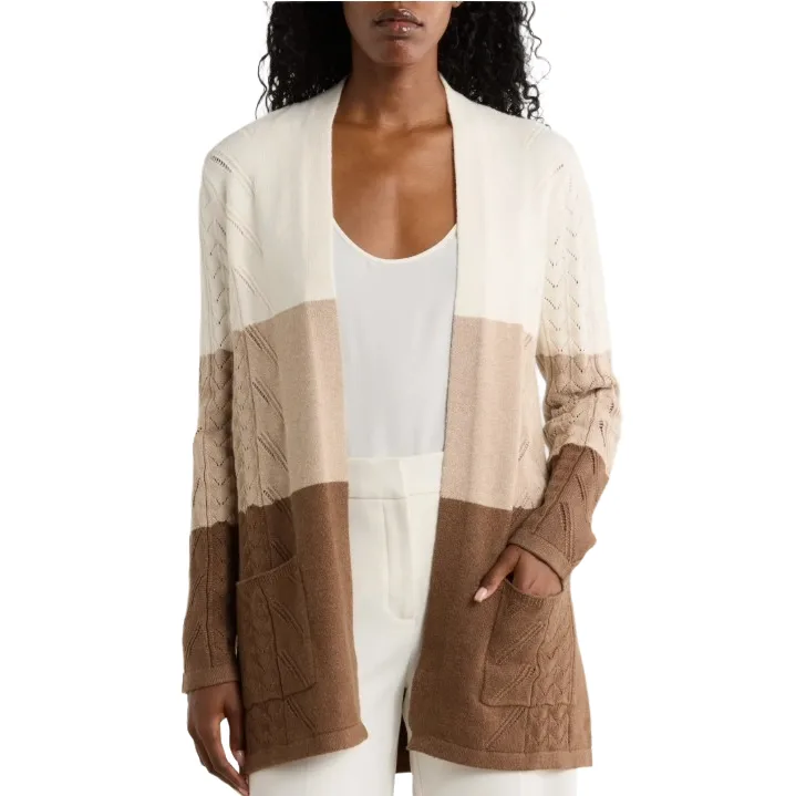 Color-blocked cardigan with cable knit details, featuring shades of cream, beige, and brown, and front pockets.