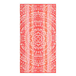 A pink and orange patterned towel featuring a symmetrical, ornate design with floral and abstract elements.