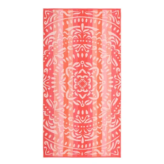 A pink and orange patterned towel featuring a symmetrical, ornate design with floral and abstract elements.