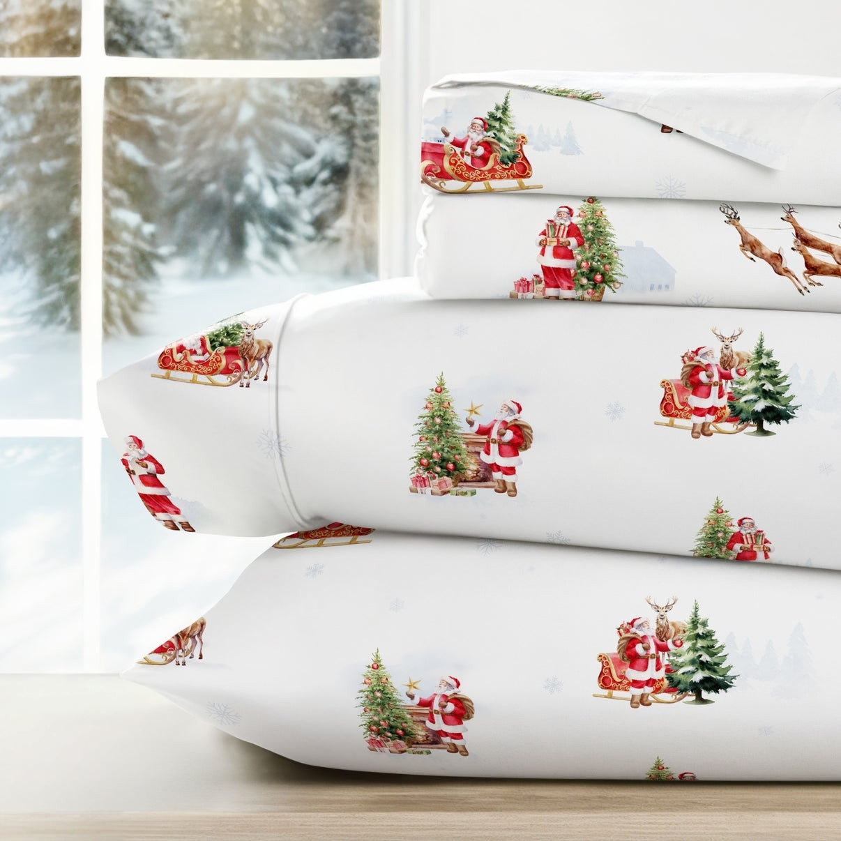Festive bedding set featuring Santa Claus, reindeer, and Christmas trees on a white background, with a snowy winter scene outside the window.
