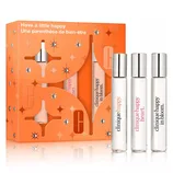 Three Clinique perfumes are shown: \“Happy,\“ \“Happy Heart,\“ and \“Happy in Bloom,\“ in a gift set with an orange decorative box.