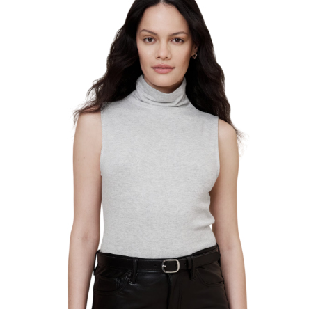 A sleeveless, light gray turtleneck top paired with black leather pants.