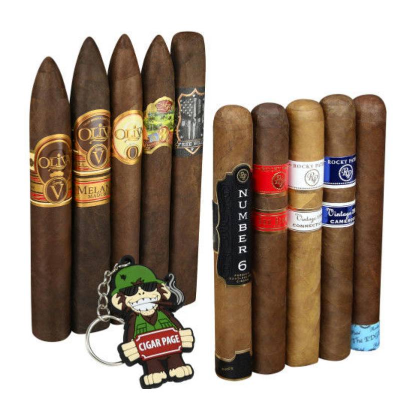 Assorted cigars with various labels and a keychain featuring a cartoon character holding a 'Cigar Page' sign.