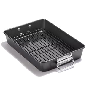 A rectangular roasting pan with a removable rack and metal handles, designed for baking or roasting.