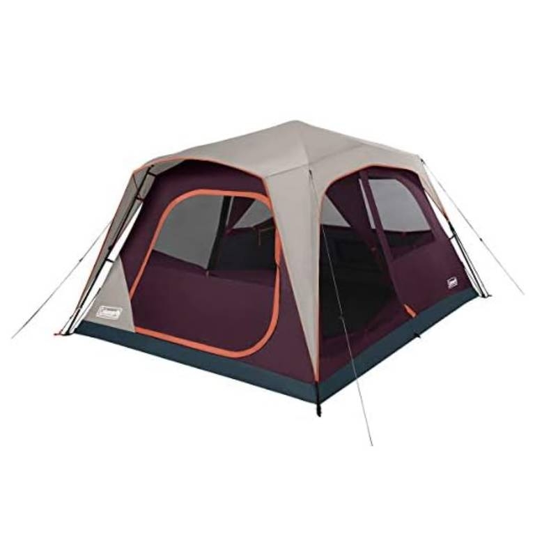 A cabin-style tent with a beige and burgundy color scheme, featuring multiple large windows and extended guy lines for stability.