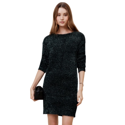 The Banana Republic Factory Tinsel Dress is a shimmering, knee-length dress with three-quarter sleeves and a relaxed fit, made from a glittery fabric. It is accessorized with a small black clutch.
