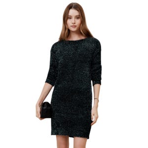 The Banana Republic Factory Tinsel Dress is a shimmering, knee-length dress with three-quarter sleeves and a relaxed fit, made from a glittery fabric. It is accessorized with a small black clutch.