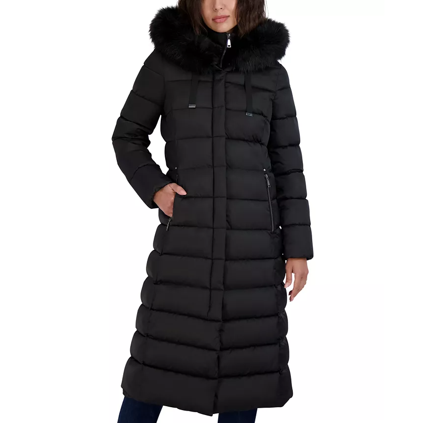 Black, long puffer coat with a bibbed design, featuring a fur-trimmed hood and zippered pockets for a warm, stylish look.