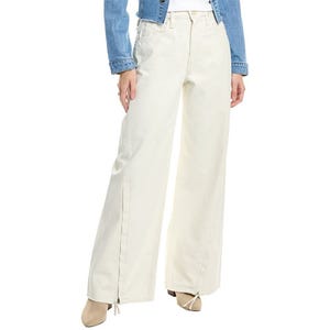 Hudson Wide Leg Jeans feature a light beige color with a full-length, wide-leg design. They have a classic five-pocket style and are paired with ankle boots and a blue denim jacket.