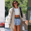 three candid photos of emma chamberlain, hailey bieber, and zendaya all sporting casual street style looks