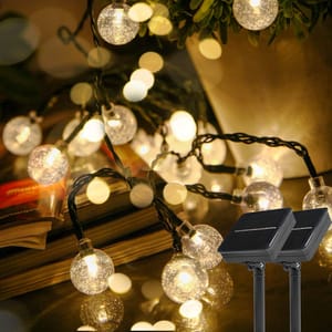 Solar-powered LED string lights with a multi-panel solar charger.