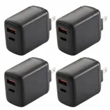 Four black wall chargers with both USB-A and USB-C ports, designed for electrical outlets.