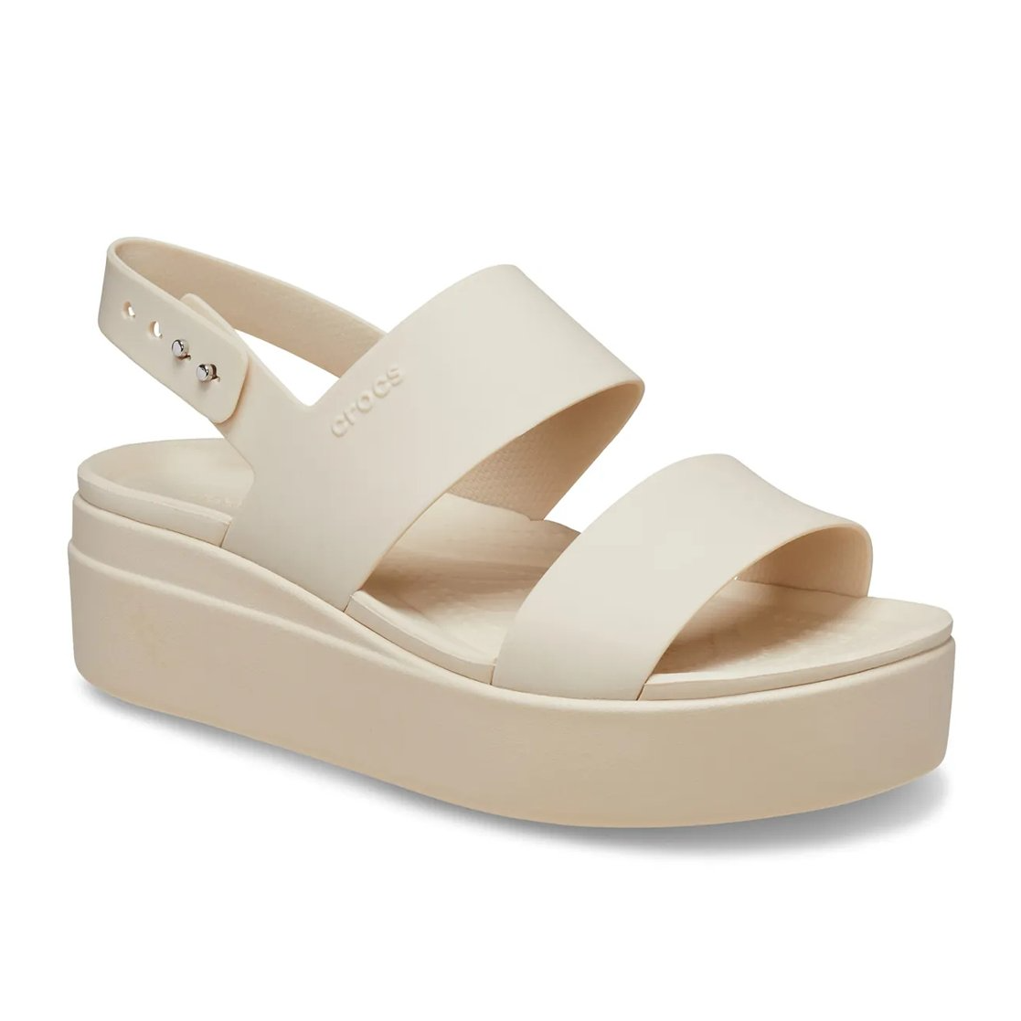 Cream-colored platform sandal with slingback strap and adjustable buckle, featuring the Crocs logo on the side.