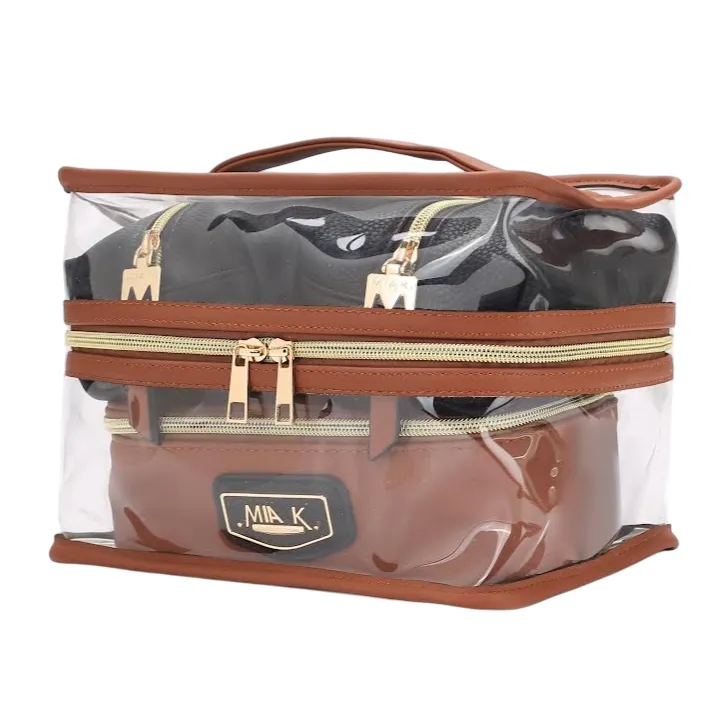 A transparent storage bag with brown trim, featuring two zippered compartments. The bag displays \“Mia K.\“ branding on the front.