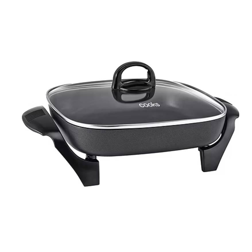 A black square electric skillet with a glass lid, featuring side handles and a raised, stable base.