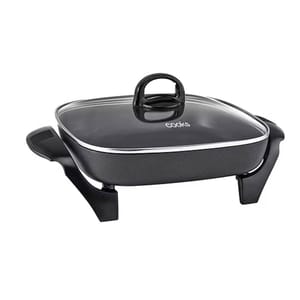 A black square electric skillet with a glass lid, featuring side handles and a raised, stable base.