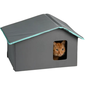 A gray, house-shaped pet shelter with a small window shows an orange cat peering out.